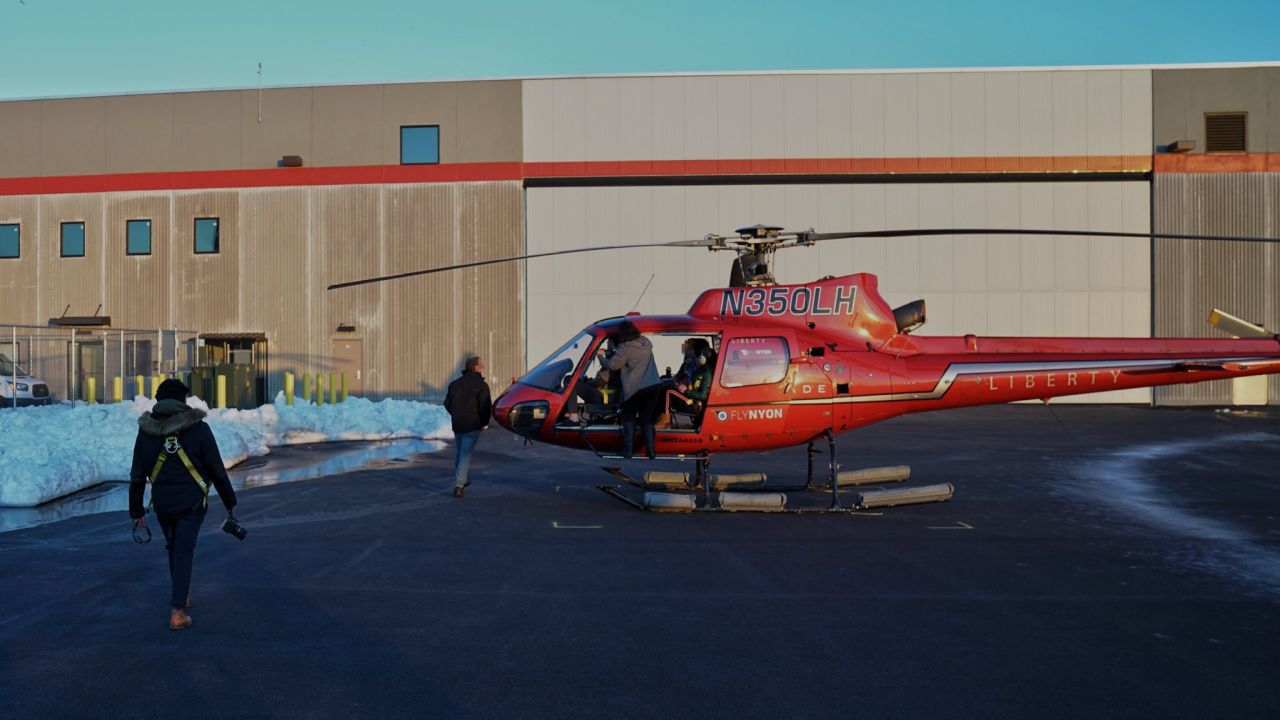 The N350LH helicopter shown here with no doors later crashed into the East River on Sunday.