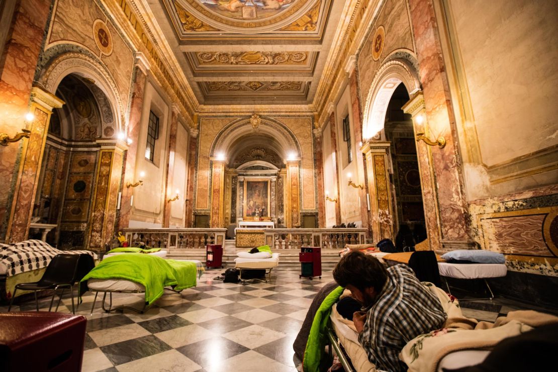 Inspired by Pope Francis' devotion to the poor, the Vatican-owned Santa Maria church offers beds to homeless migrants under priceless Renaissance frescoes.