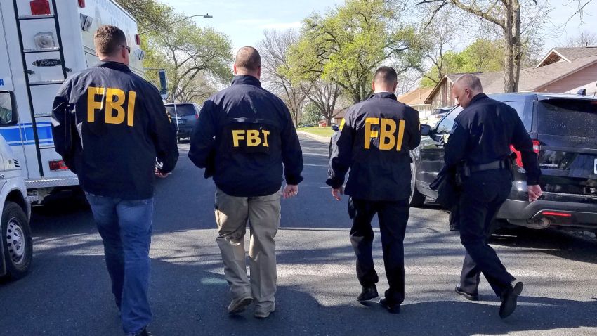 An image tweeted by the Austin police department shows members of the FBI.