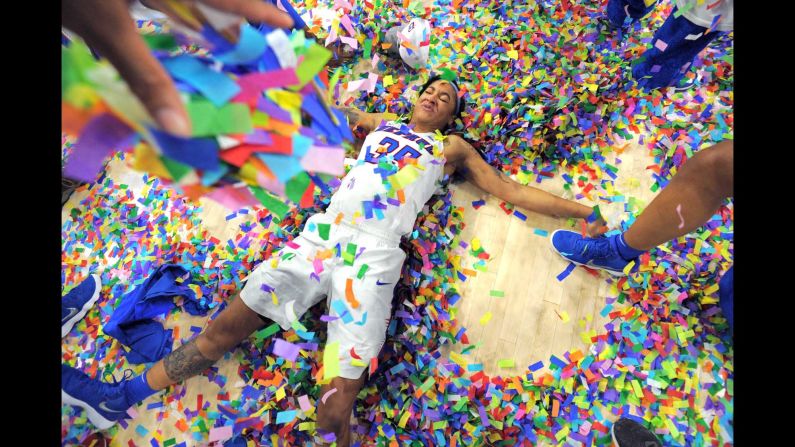 DePaul forward Mart'e Grays makes a "confetti angel" after her team won the Big East basketball tournament on Tuesday, March 6.