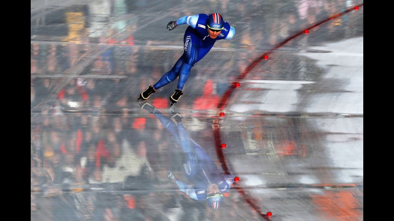 The ice reflects Norway's Sverre Lunde Pedersen during a race at the World Allround Speed Skating Championships on Sunday, March 11. Pedersen was on his way to gold when he fell during the 10,000 meters and had to settle for silver.