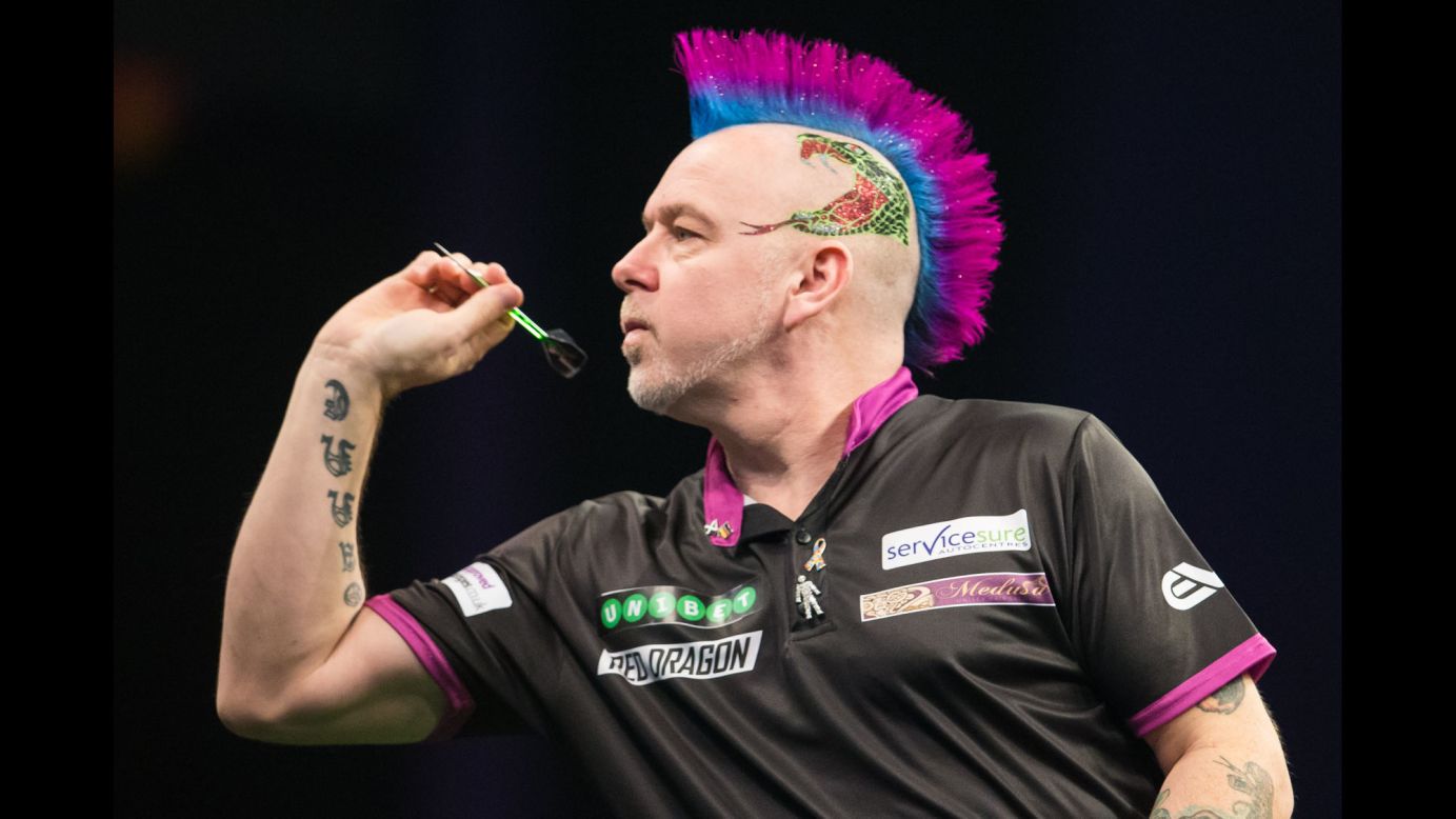 The always colorful Peter Wright competes in a Premier League Darts match in Leeds, England, on Thursday, March 8.