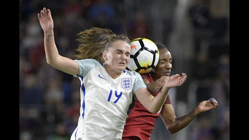 England forward Mel Lawley, left, and US forward Crystal Dunn compete for a header during a soccer match in Orlando, Florida, on Wednesday, March 7. The Americans won the match 1-0 to clinch the SheBelieves Cup.