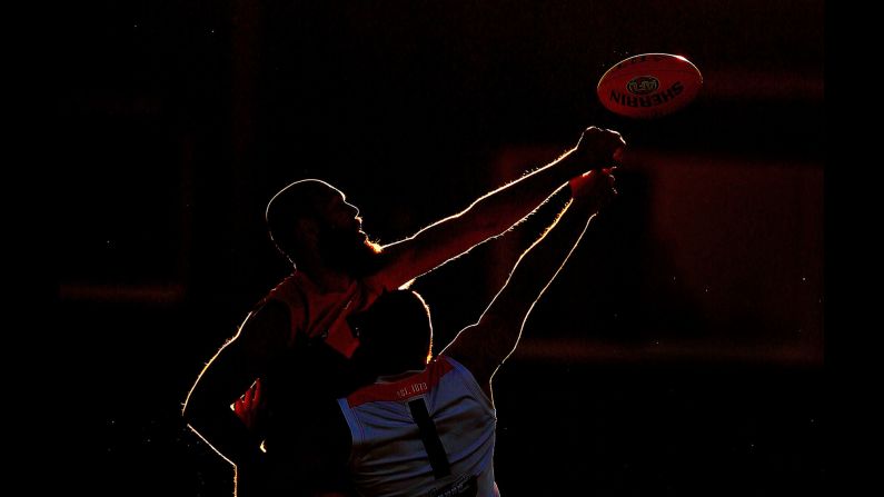 Melbourne's Max Gawn, top, and St. Kilda's Tom Hickey compete for the ball during an Australian Football League match on Thursday, March 8.