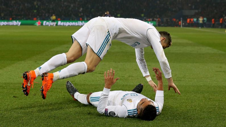 Cristiano Ronaldo jumps onto Real Madrid teammate Casemiro as they celebrate a Champions League goal in Paris on Tuesday, March 6. Madrid defeated Paris Saint-Germain 5-2 on aggregate to advance to the quarterfinals.