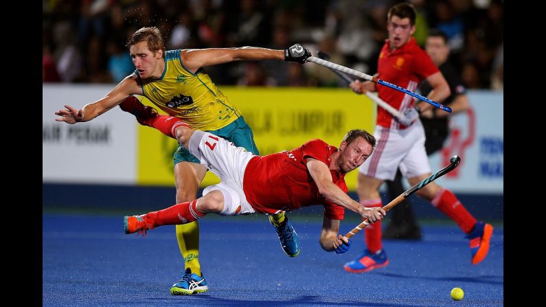 England's Barry Middleton is tackled by Australia's Daniel Beale during the final of a field hockey tournament in Ipoh, Malaysia, on Saturday, March 10. Australia won 2-1 to claim the Sultan Azlan Shah Cup.
