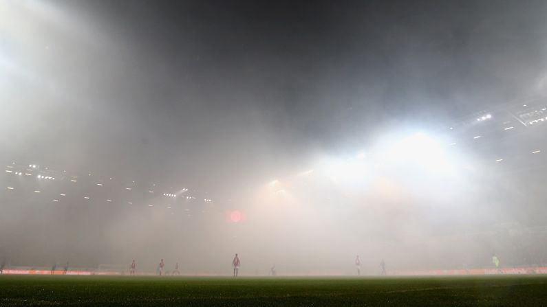 Fog covers a soccer field in Mainz, Germany, after fans burned flares during the Bundesliga match between Mainz and Schalke on Friday, March 9. <a target="_blank">See 25 amazing sports photos from last week</a>