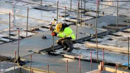 A construction worker can be seen working on a construction site. 