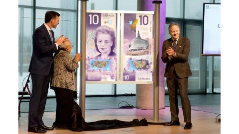 Canadian Finance Minister Bill Morneau, Desmond's sister Wanda Robson and Bank of Canada governor Stephen Poloz, right, helped unveil the design for the new bank note.