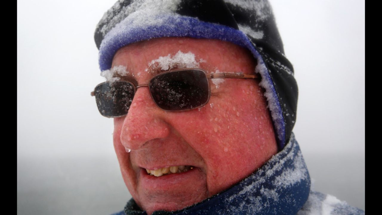 Snow accumulates on Paul Knight's eyebrows as he walks in Portland, Maine, on March 13. "We're not out of winter yet, that's for sure," he said.