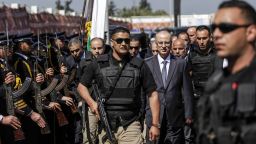 Palestinian Prime Minister Rami Hamdallah (3rd-R), escorted by his bodyguards, is greeted by police forces of the Islamist Hamas movement (L) upon his arrival in Gaza City on March 13, 2018. / AFP PHOTO / MAHMUD HAMS        (Photo credit should read MAHMUD HAMS/AFP/Getty Images)