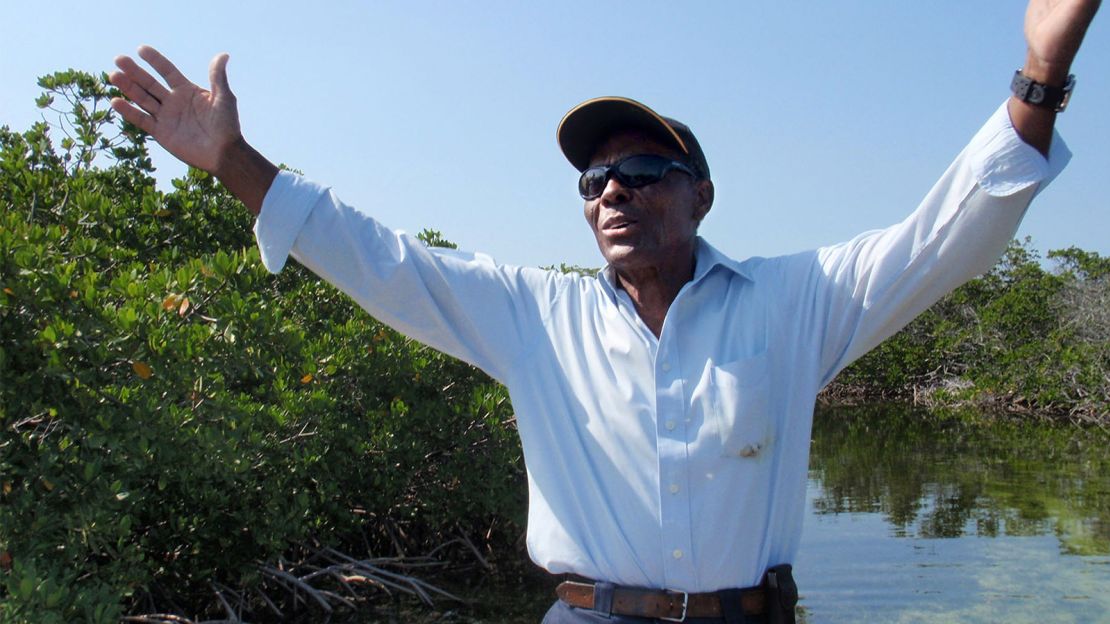 Ansil Saunders: The boatbuilder poses in the same grove where he used to take King.