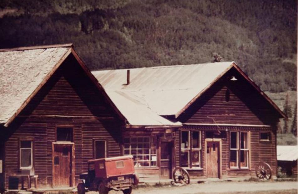 <strong>Struggling community:</strong> The log houses the community built were abandoned when the miners left. "At its peak, there were about 500 people living in the valley, but when the train came in, the people left and moved closer to the train," says Rossi.