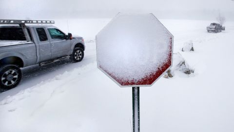 Wind-blown snow covers a stop sign in Derry, New Hampshire, on March 13.