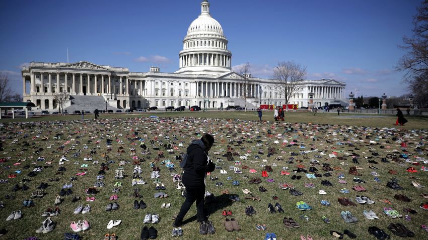 WASHINGTON, DC - MARCH 13:  Seven thousand pairs of shoes, representing the children killed by gun violence since the mass shooting at Sandy Hook Elementary School in 2012, are spread out on the lawn on the east side of the U.S. Capitol March 13, 2018 in Washington, DC. Organized by the online activist group Avaaz, the shoes are intended to urge Congress to pass gun-reform legislation.   (Photo by Chip Somodevilla/Getty Images)