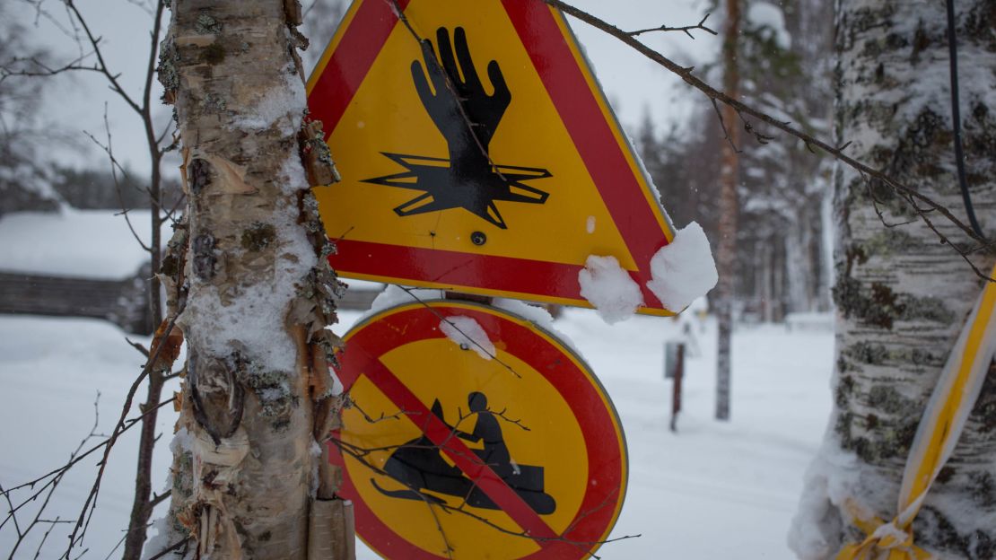 Icy warning signs keep snowmobiles on track.