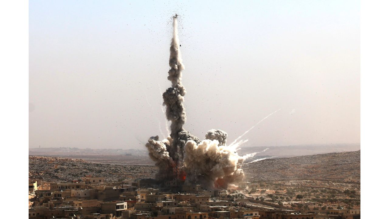 Smoke rises after a warcraft belonging to the Russian Army bombed a residential area in the Darat Izza neighborhood of Aleppo.