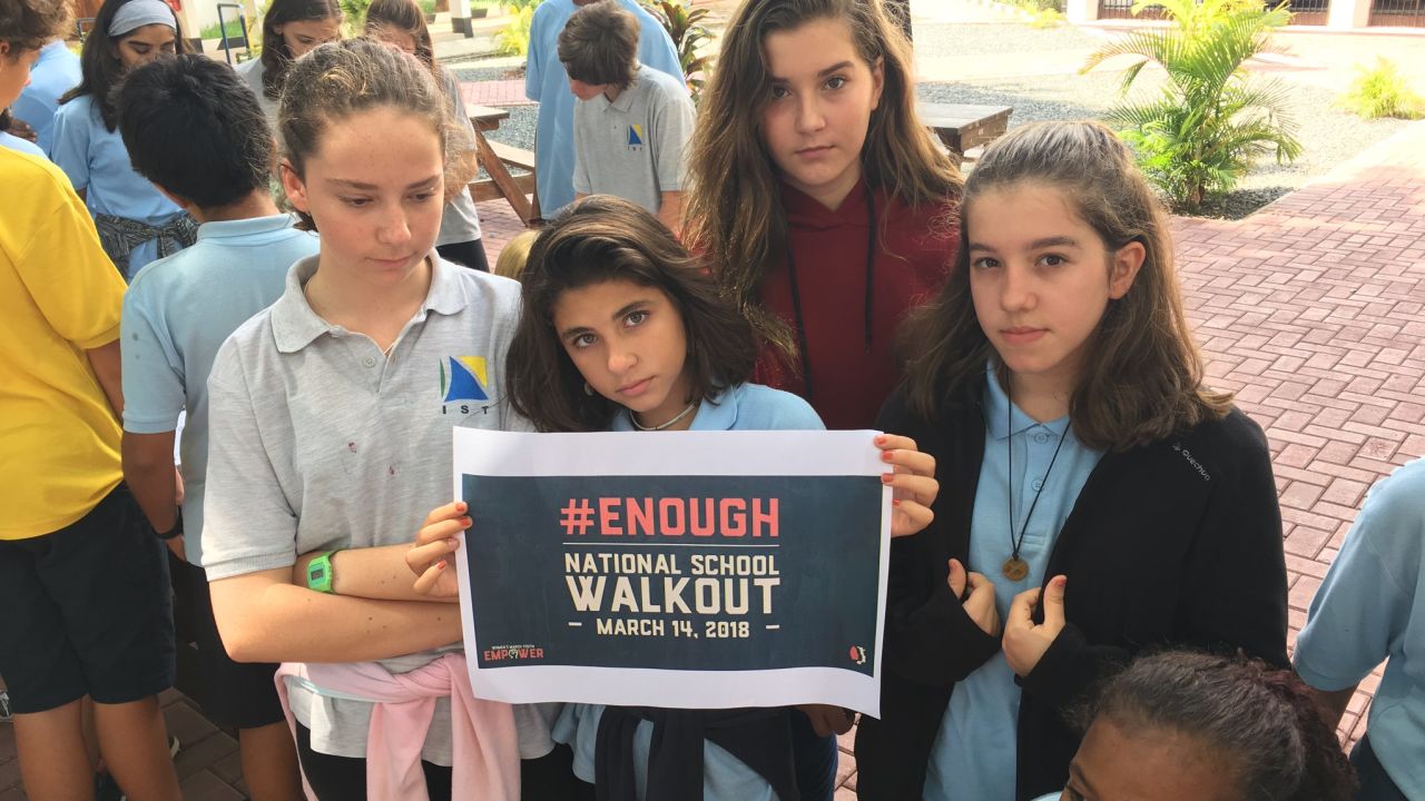 Students at the International School of Tanganyika in Tanzania hold a walkout Wednesday, March 14, 2018.