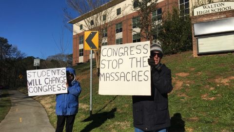 Parents of students at Walton High School in suburban Atlanta protest outside the school.