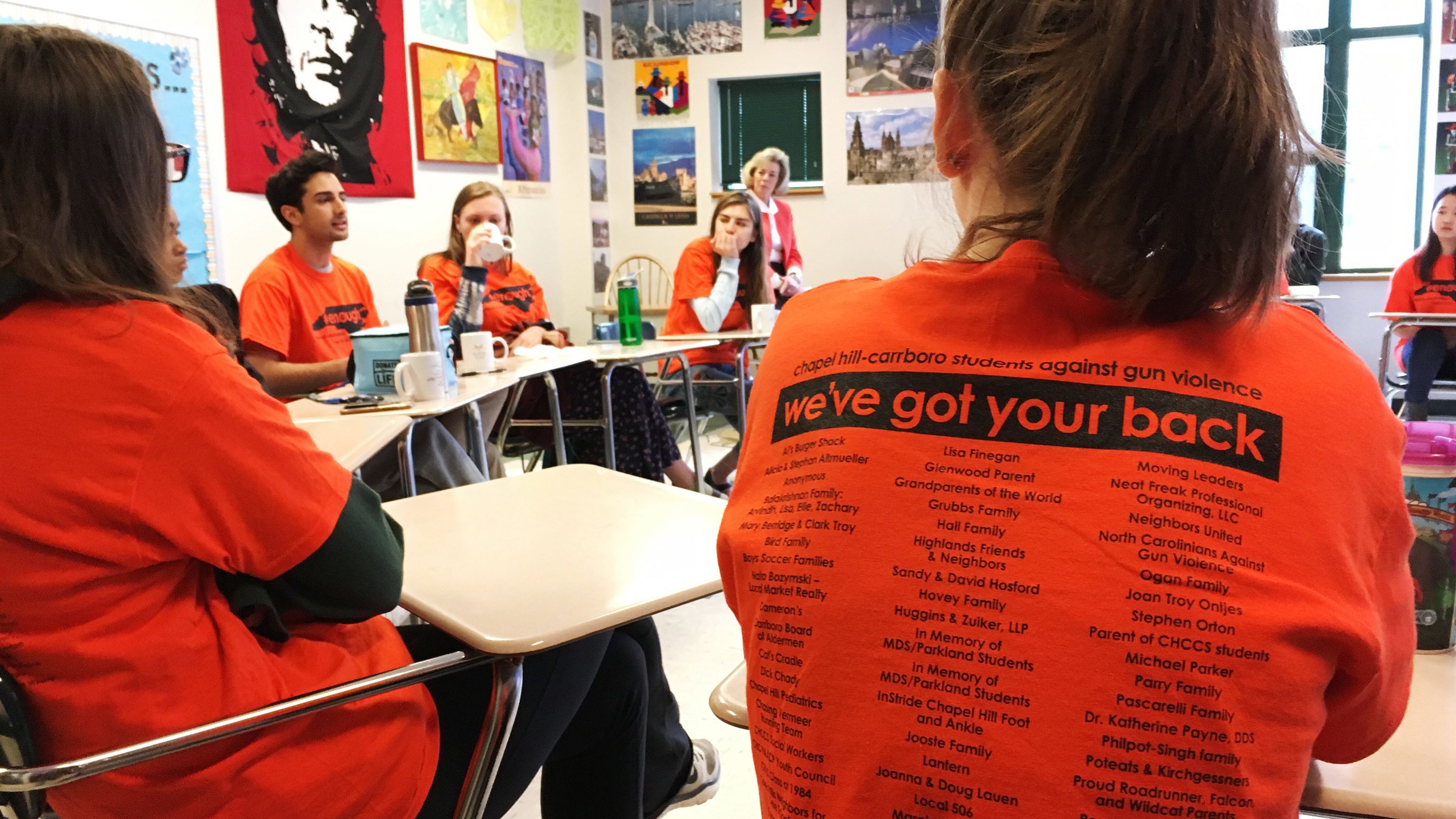 Students discuss gun violence ahead of a walkout at East Chapel Hill High School on Wednesday, March 14, 2018, in Chapel Hill, N.C. 