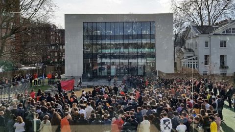 Students at the American School in London hold their walkout.