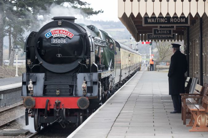 <strong>Steam age:</strong> Racegoers arrive in style on the historic Merchant Navy class Penisular and Oriental steam train at Cheltenham Racecourse station.