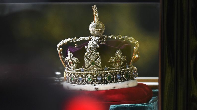 <strong>Britain's showpieces: </strong>The Tower also plays host to Britain's Crown Jewels. Under armed guard inside the Tower, they're a marvel to behold. The Imperial State Crown -- pictured here traveling by car to  the State Opening of Parliament -- was made in 1937, using precious jewels said to date back to the 1300s. 