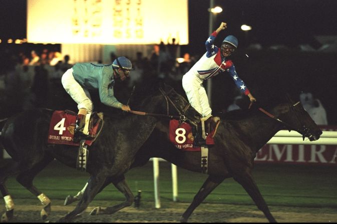 American rider Gerry Bailey salutes the crowd as he wins the inaugural Dubai World Cup on Cigar in 1996.
