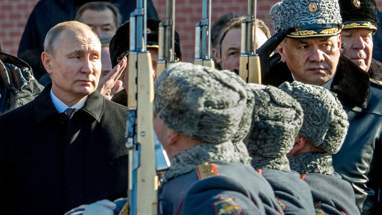 Russian President Vladimir Putin (L) and Defence Minister Sergey Shoygu (R) attend a wreath laying ceremony at the Tomb of the Unknown Soldier near the Kremlin wall to mark Defender of the Fatherland Day in Moscow on February 23, 2018. 
Defender of the Fatherland Day, celebrated in Russia on February 23, honours the nation's army and is a nationwide holiday.  / AFP PHOTO / Yuri KADOBNOV        (Photo credit should read YURI KADOBNOV/AFP/Getty Images)