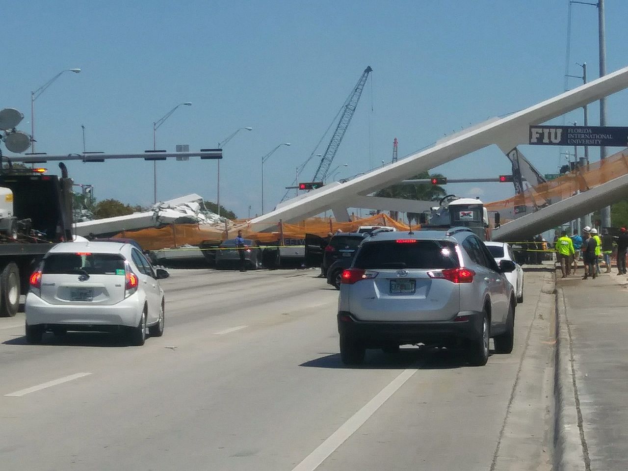 Candace Pridemore took this photo of the collapsed bridge. "I was sitting in a truck," she said. "We were pulled over to the side working. I looked over and there was a bridge coming down. I started screaming, 'It's going, it's going down.'"