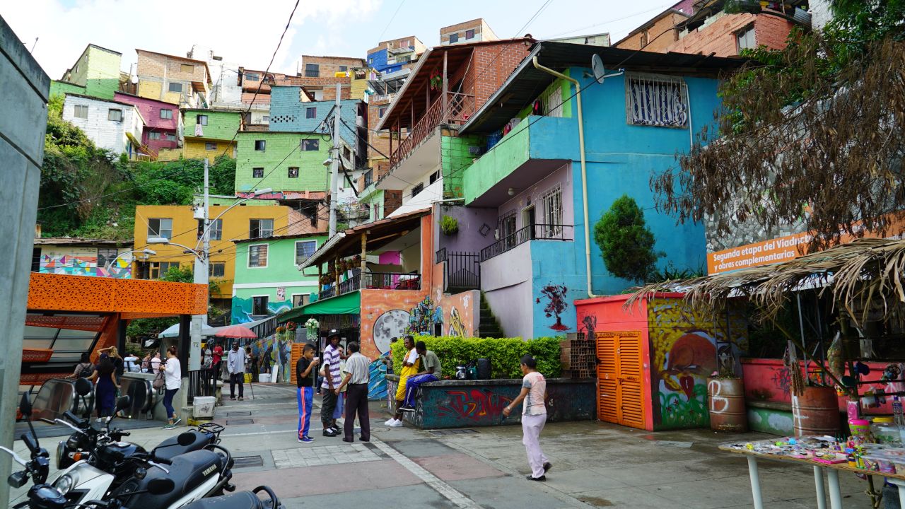 Colorful houses and food stalls line the Medellín streets.