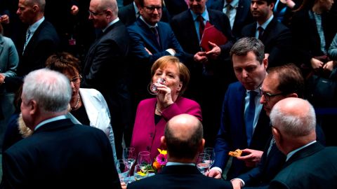 German Chancellor Angela Merkel has a drink in Berlin after a coalition contract was signed for Germany's new government on Monday, March 12. A couple days later, <a href="https://www.cnn.com/2018/03/14/europe/merkel-chancellor-fourth-term-germany-intl/index.html" target="_blank">lawmakers voted to re-elect Merkel</a> for a fourth term. <a href="https://www.cnn.com/2013/09/19/europe/gallery/angela-merkel-career/index.html" target="_blank">See photos of Merkel's life and career</a>