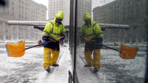 A worker shovels snow in Boston on Tuesday, March 13. New England was dealing with <a href="https://www.cnn.com/2018/03/13/weather/northeast-winter-storm/index.html" target="_blank">its third nor'easter in two weeks.</a>