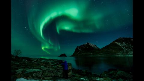 A person watches the Northern Lights in Utakleiv, Norway, on Friday, March 9.