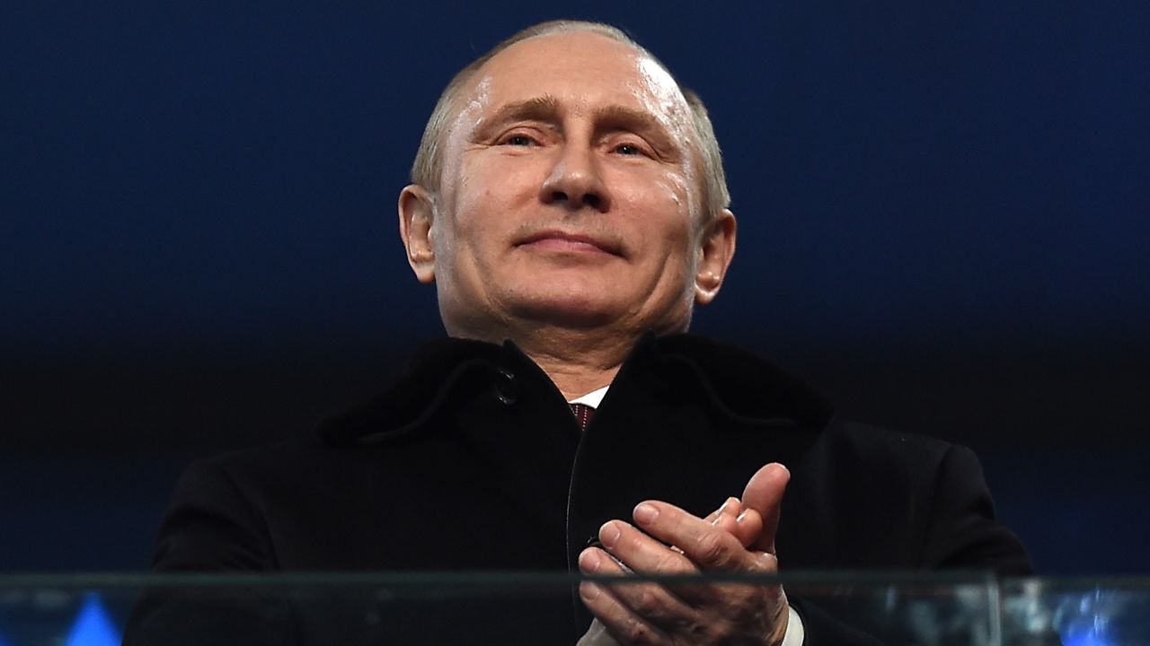 SOCHI, RUSSIA - FEBRUARY 07: Russian President Vladimir Putin (R) enjoys the atmosphere during the Opening Ceremony of the Sochi 2014 Winter Olympics at Fisht Olympic Stadium on February 7, 2014 in Sochi, Russia.  (Photo by Pascal Le Segretain/Getty Images)