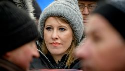 Russian TV journalist and presidential candidate Ksenia Sobchak (C) stands during an opposition march in memory of murdered Kremlin critic Boris Nemtsov in central Moscow on February 25, 2018. 
The 55-year-old former first deputy prime minister under Boris Yeltsin was shot in the back several times just before midnight on February 27, 2015 as he walked across a bridge a stone's throw from the Kremlin walls. / AFP PHOTO / Yuri KADOBNOV        (Photo credit should read YURI KADOBNOV/AFP/Getty Images)