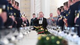 Russian President Vladimir Putin toasts with attendees after a ceremony to bestow state awards on military personnel who fought in Syria, at the Kremlin in Moscow on December 28, 2017. / AFP PHOTO / POOL / Kirill KUDRYAVTSEV        (Photo credit should read KIRILL KUDRYAVTSEV/AFP/Getty Images)