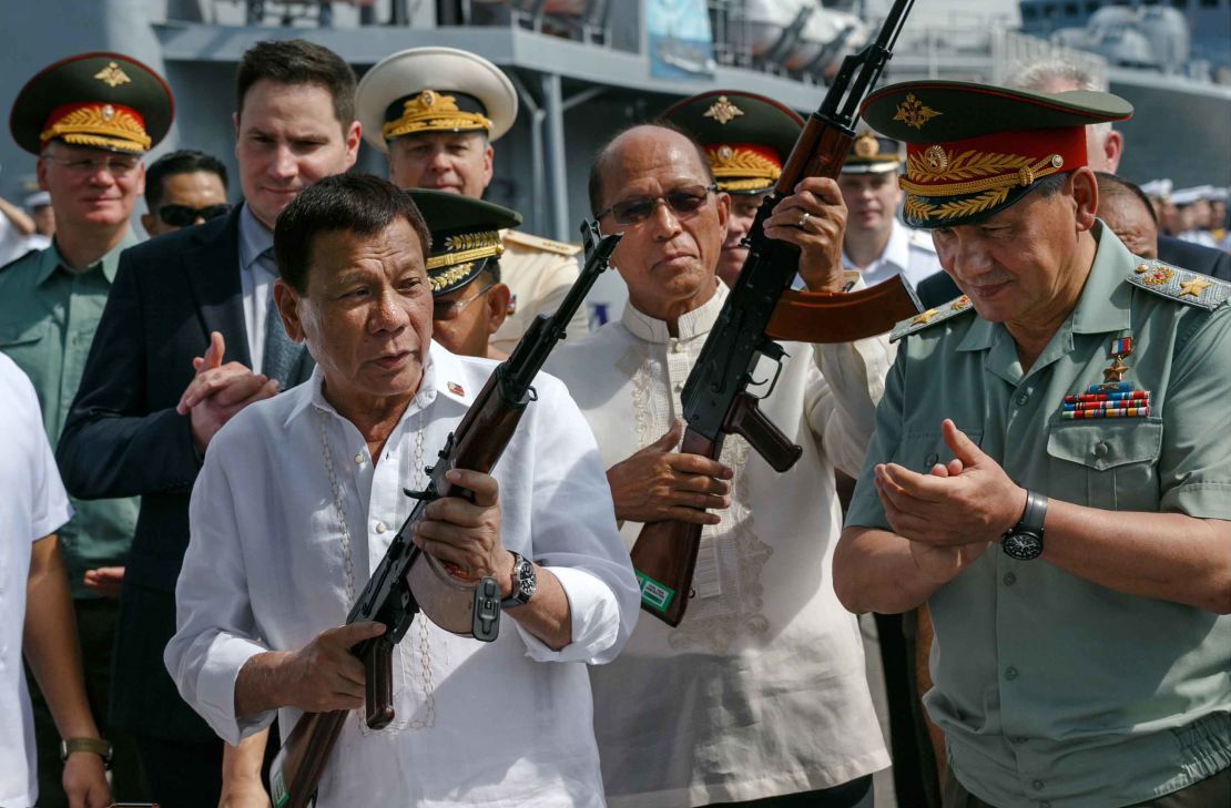 Philippine President Rodrigo Duterte, front left, with Russia's Defence Minister Sergei Shoigu, right,  after the delivery of Russian arms to the Southeast Asian nation. 