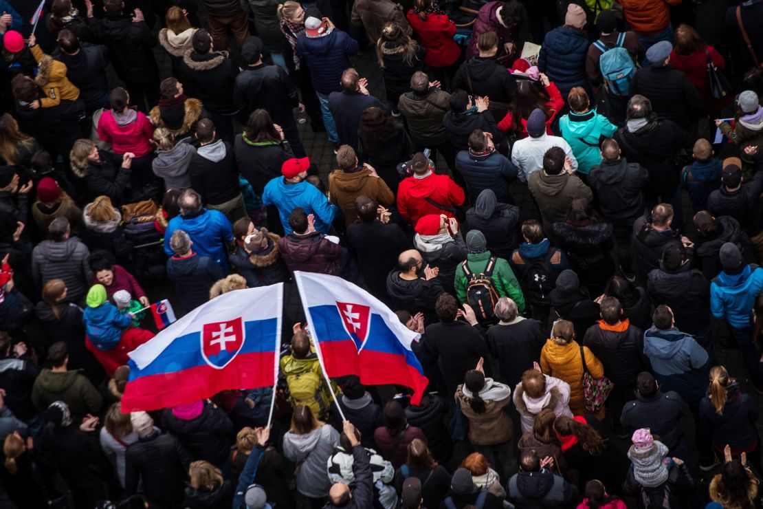 Protesters pay tribute to slain Slovak journalist Jan Kuciak and his fiancée, Martina Kušnírová.