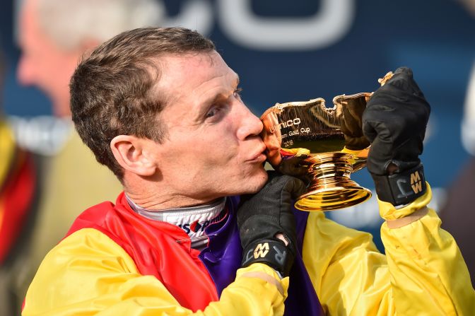 <strong>Long overdue: </strong>Winning jockey Richard Johnson, 40, saluted his "fantastic horse" -- trained by Colin Tizzard -- after winning his second Gold Cup 18 years after his first on Looks Like Trouble in 2000. 