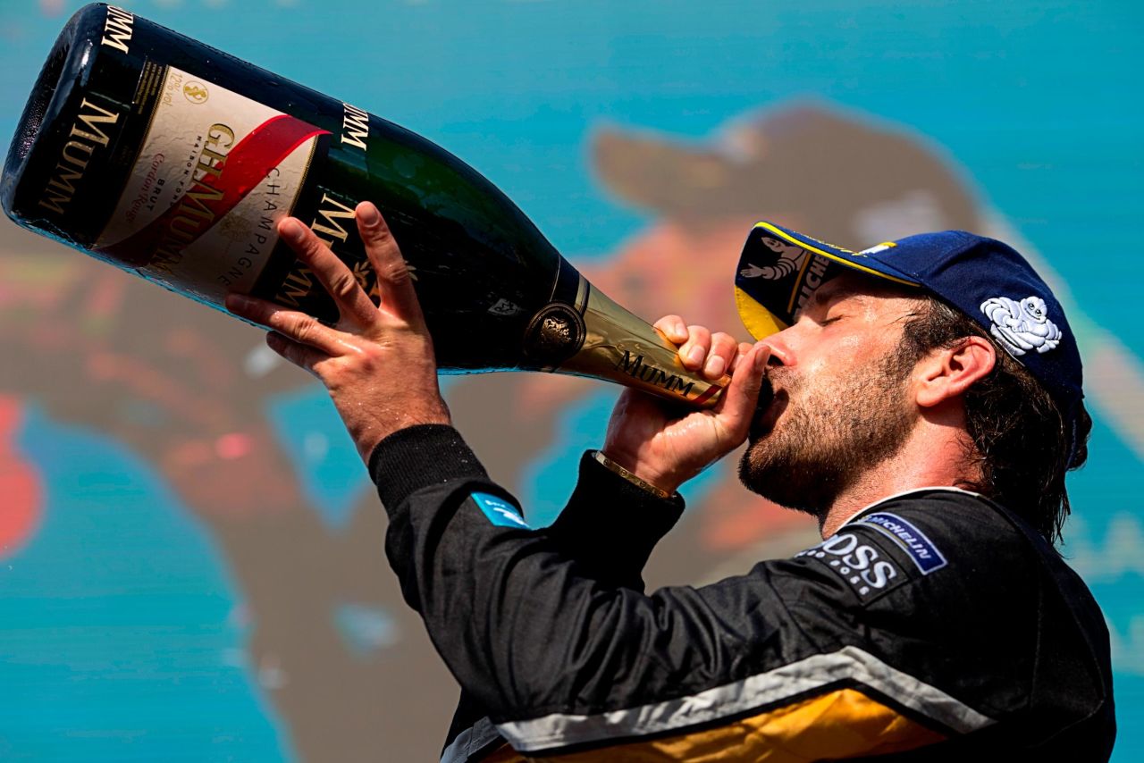Vergne celebrated with a swig of champagne. 