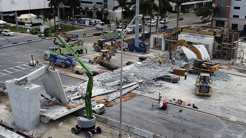 Recovery operations continue Saturday morning, March 17, 2018, at the site of the Florida International University-Sweetwater University bridge in the Miami area that collapsed during construction earlier in the week. (Pedro Portal/Miami Herald via AP)
