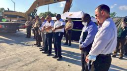 Moment of silence at the scene of the FIU Bridge Collapse on March 17, 2018 (Twitter photo)