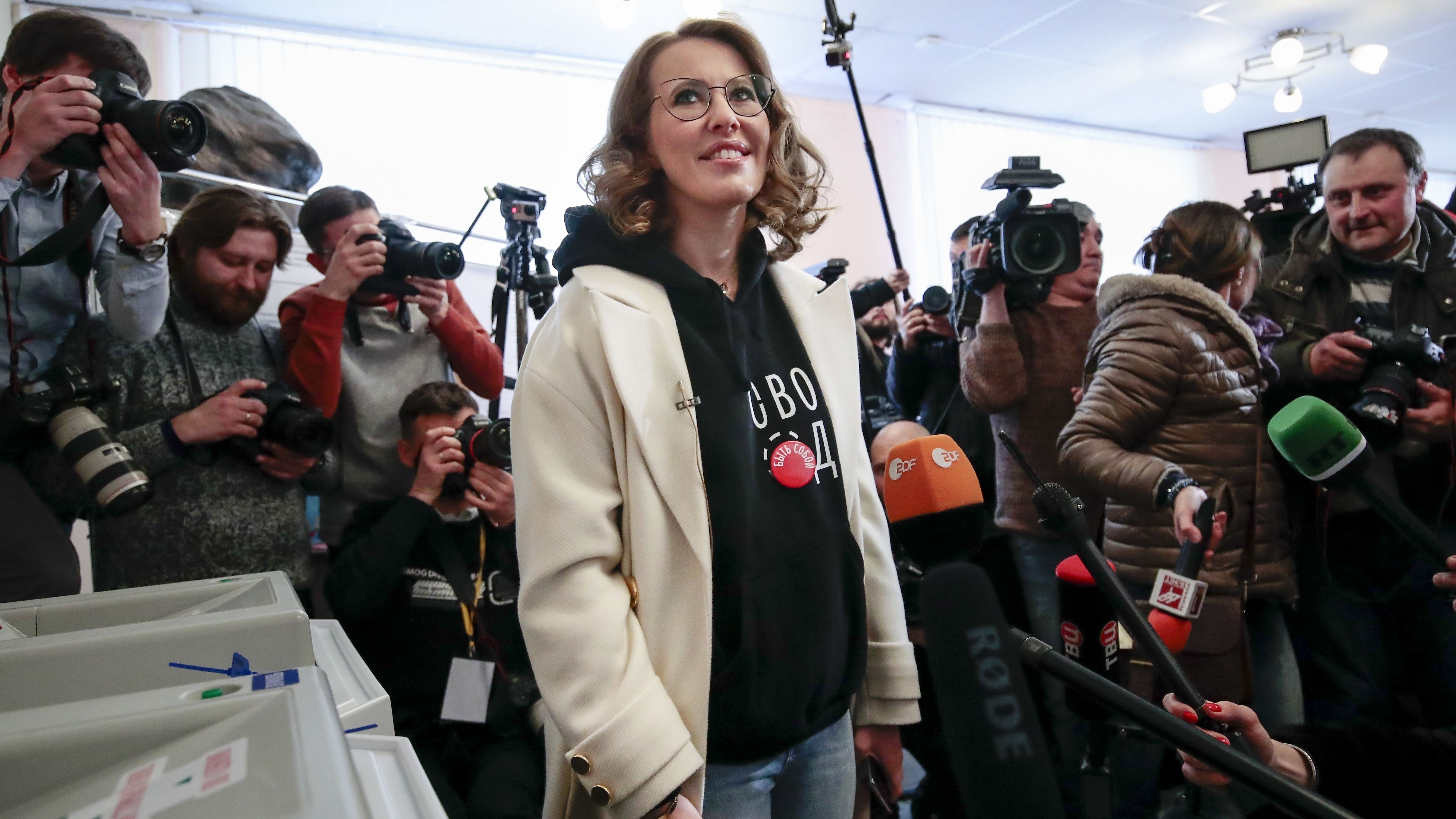 Presidential candidate Ksenia Sobchak smiles as she speaks to the media after voting during the Russian presidential election in Moscow.