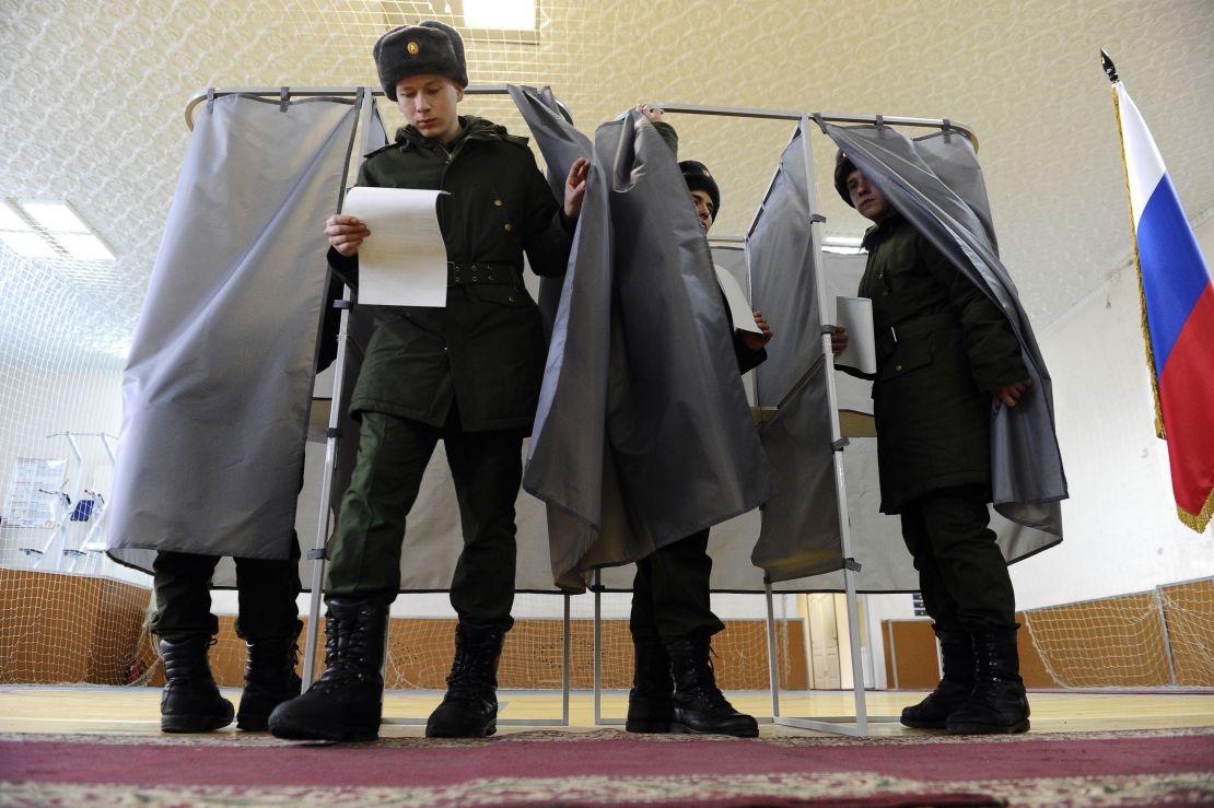 Russian soldiers vote in Rostov-on-Don, Russia on Sunday.