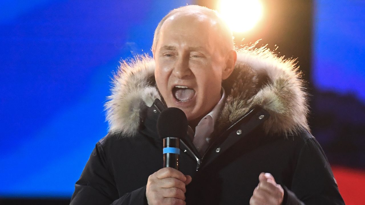 Presidential candidate, President Vladimir Putin addresses the crowd during a rally and a concert celebrating the fourth anniversary of Russia's annexation of Crimea at Manezhnaya Square in Moscow on March 18, 2018.