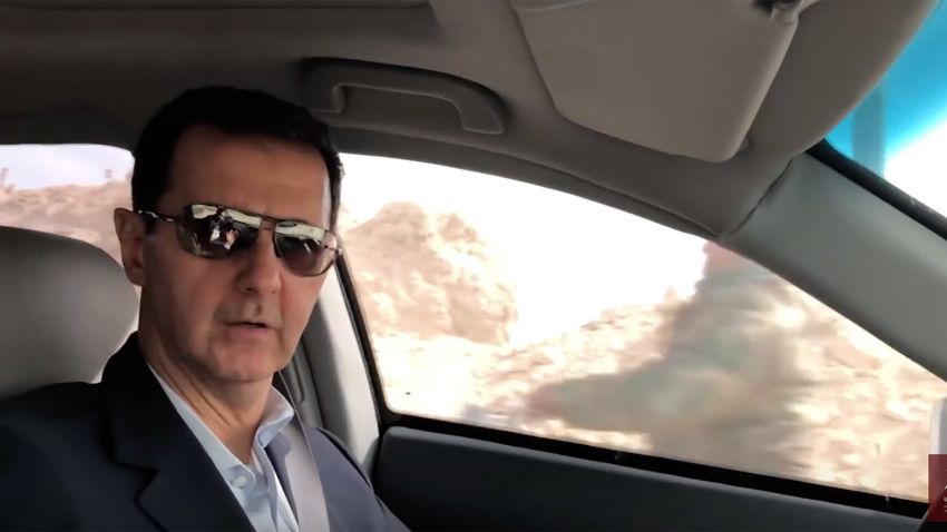 Syrian President Bashar al Assad drives through newly recaptured parts of Eastern Ghouta. 