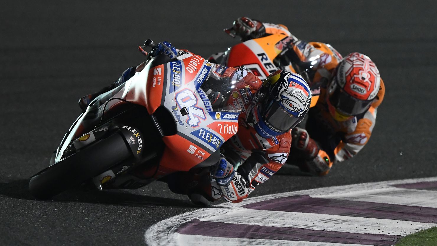 Ducati's Andrea Dovizioso leads Honda's Marc Marquez in a thrilling finale to the MotoGP of Qatar.
