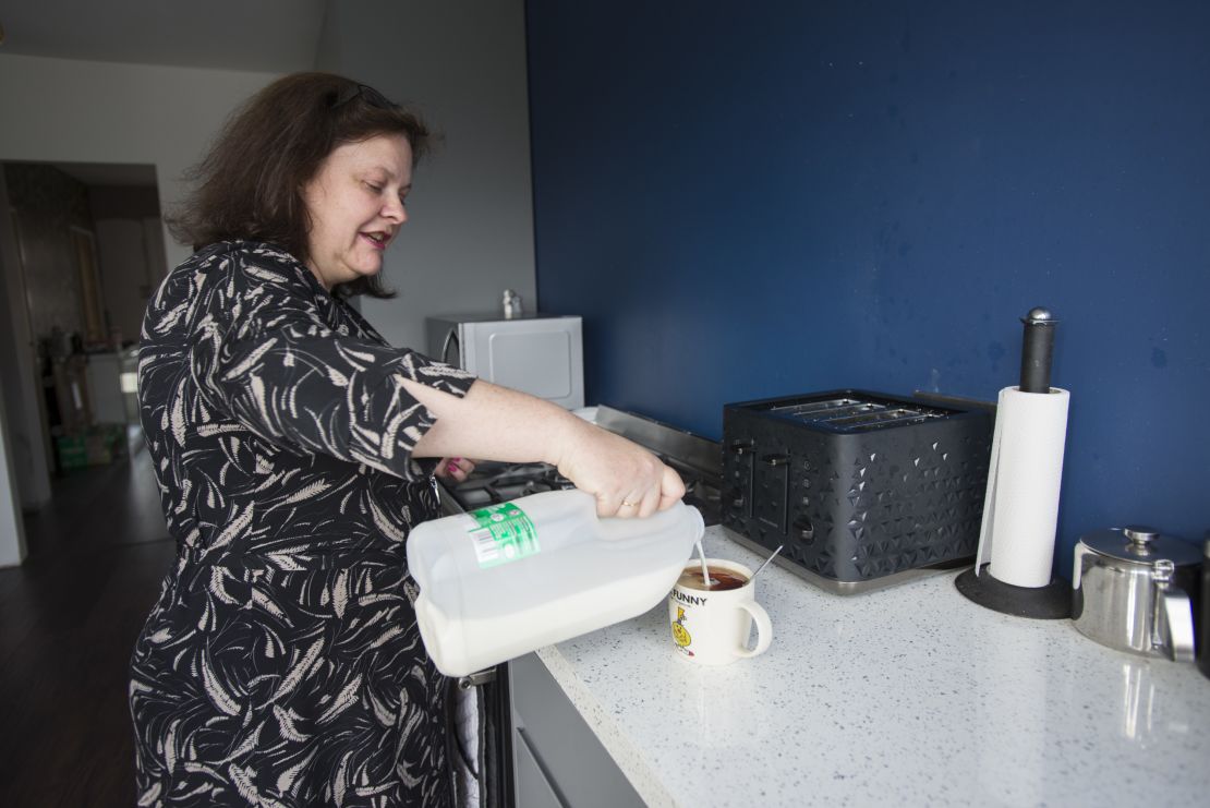 Hamblett makes tea at her home in Romford.