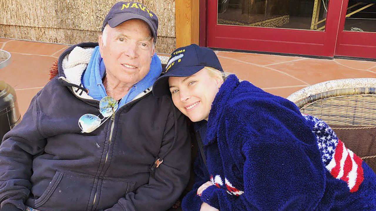 "No place I would rather be," Meghan McCain tweeted with this photo of her and her father in March 2018. 